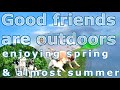 Good friends are outdoors enjoying spring and almost summer in May, 2023