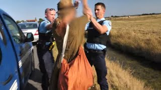 She takes a mud bath in front of the cops