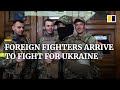 Volunteer foreign fighters arrive in Ukraine to fight Russian invasion