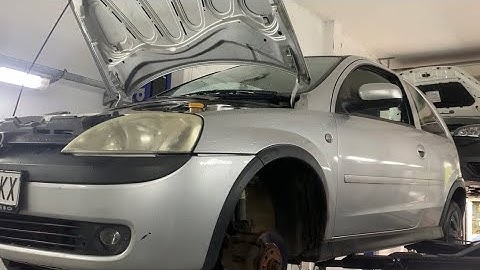 Opel Corsa C front shock absorber, spring and strut support mount replacement