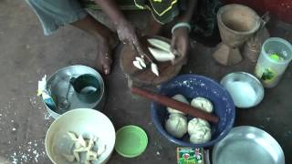 African cooking - tanzanian woman prepares traditional meals