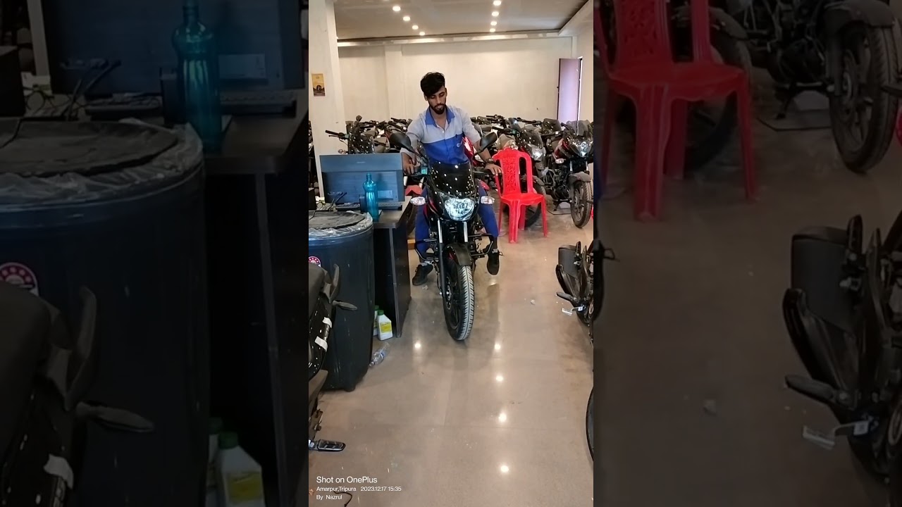 taking delivery of Bajaj showroom 