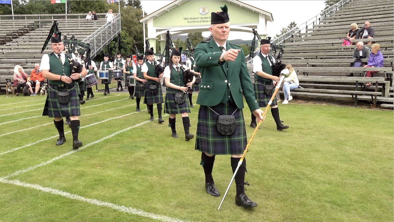 Drum Major Dean leads Huntly Pipe Band playing on the march into 2023