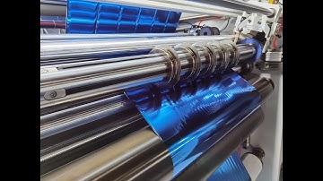 Automatic knife positioning slitter rewinder for hot stamping foils