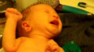 Aidan having his first bath