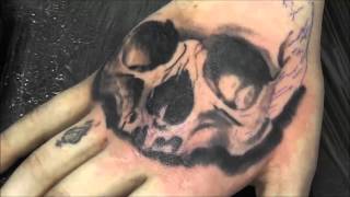 Timelapse skull tattoo on the hand.