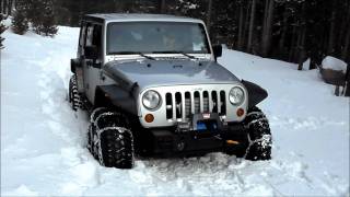 Supercharged Jeep Rubicon Unlimited testing snow chains.