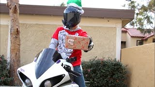 Motorcycle Santa gives out Christmas Gifts!