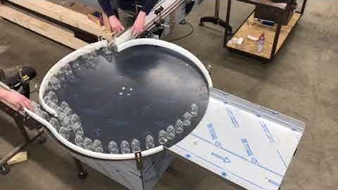 HyTek Automation Solutions - 48" accumulation table - 3 conveyor inlets - 100ml vials