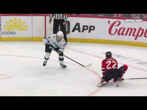 Lawson Crouse scores a goal against the New Jersey Devils