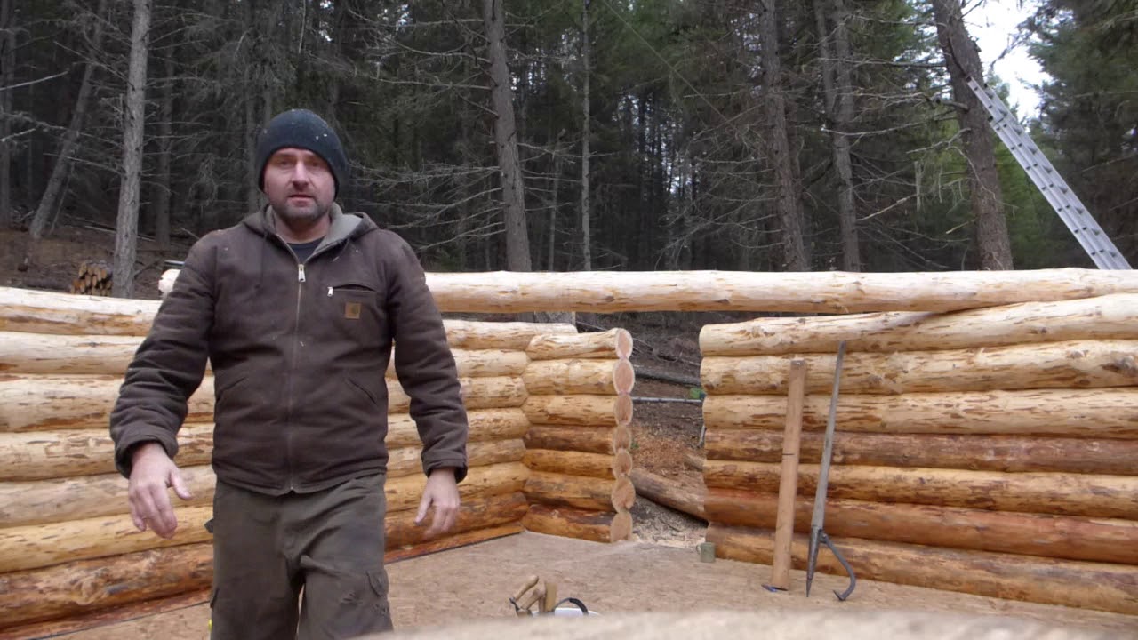 Off grid log cabin build - Moving logs on the wall by hand - YouTube