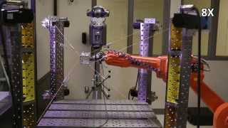 Calibration of an industrial robot using a cable robot and a laser tracker