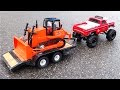 RC ADVENTURES - "BEAST" Monster Truck pulls Mini Dozer on Trailer - Heavy Snow Removal