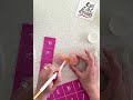 Stencil Initials on Macarons with Stay Put Stencils by Evil Cake Genius