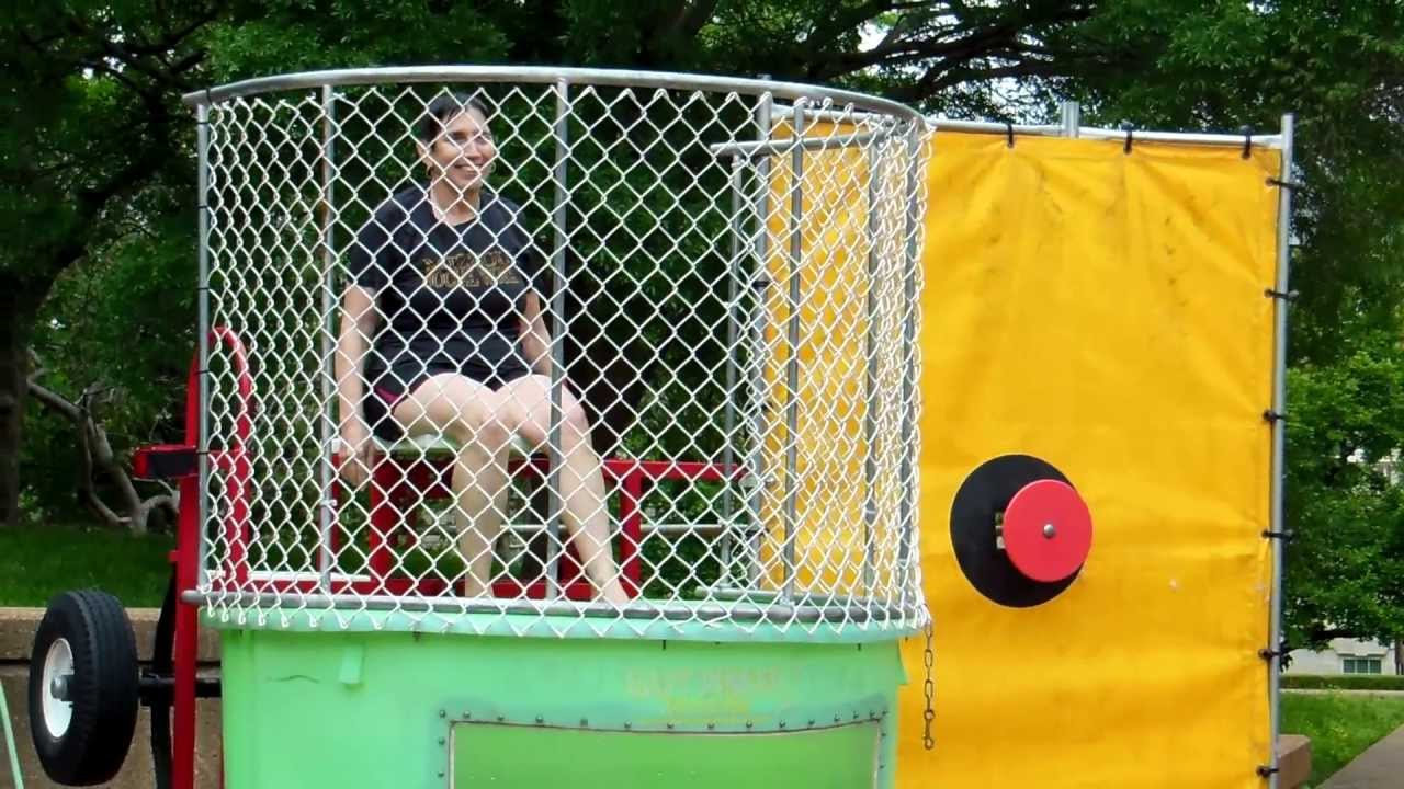 Dr. Sable supporting her staff in the dunking booth YouTube