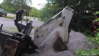 Bobcat 709 backhoe attachment for a skid steer after repair.