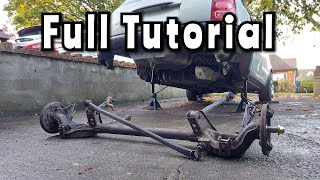 Removing the Rear Axle on a K11 Micra - Full tutorial - Shocks, Springs, Panhard Rod etc.