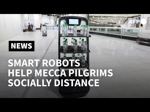 Robots distribute holy water in Mecca amid Covid hajj precautions | AFP