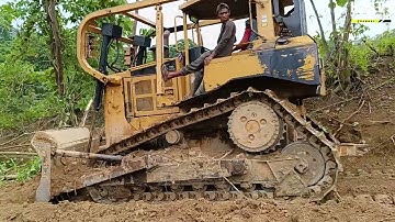 A Caterpillar D6R XL Bulldozer Operator Completes a Perfect Job Widening a Plantation Road
