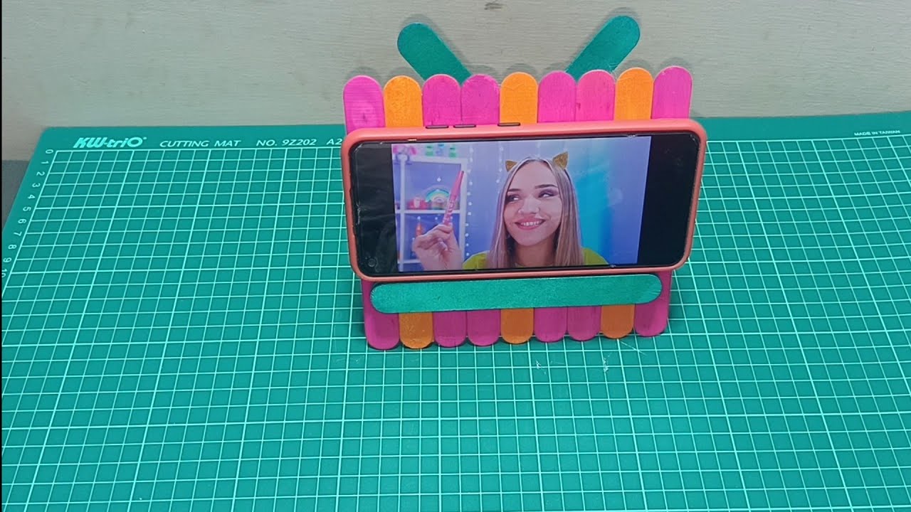 Mobile stand homemade with colorful ice cream popsicles strict