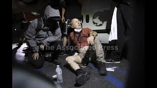 Protesters help journalist injured during protests in Compton, California over immigration raids