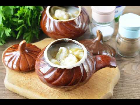 Video: Dumplings With Cheese Sauce In Pots