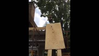 We hoisted 16 sheets of plywood up to the roof with this simple pulley system.