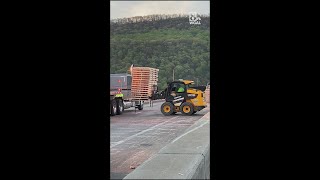 Truck overturns on Clarks Ferry Bridge, scattering pallets across Route 22