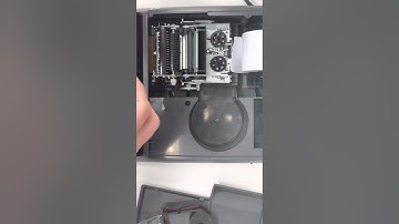Installing A Twin Spool Ink Ribbon In A Printing Calculator