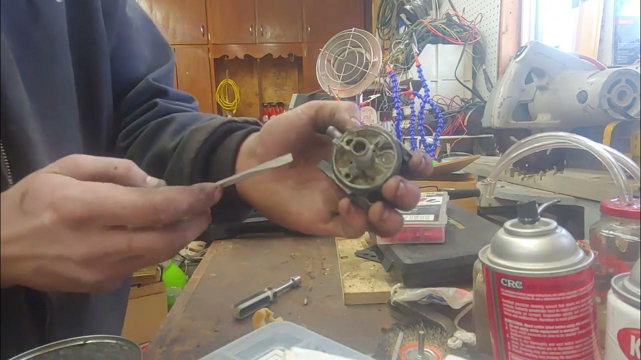a look inside a carburetor stored with ethanol gas - YouTube