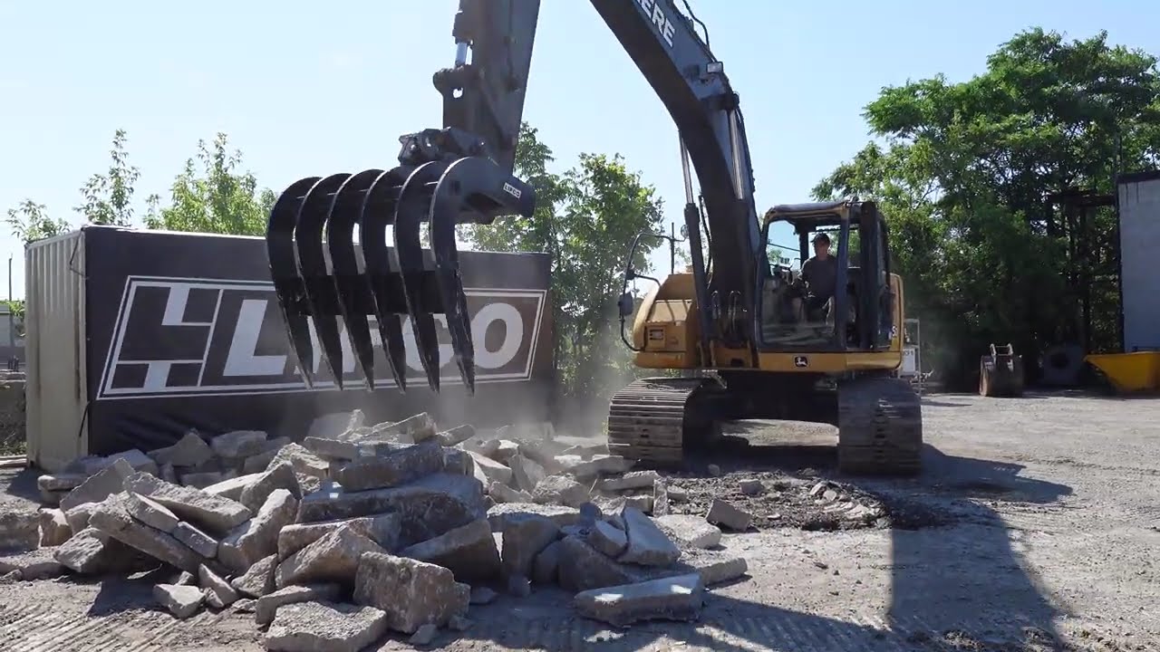 Excavator Rake vs. Concrete