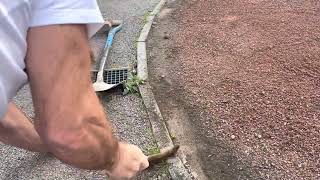 removing grass and weeds from pin kerbs