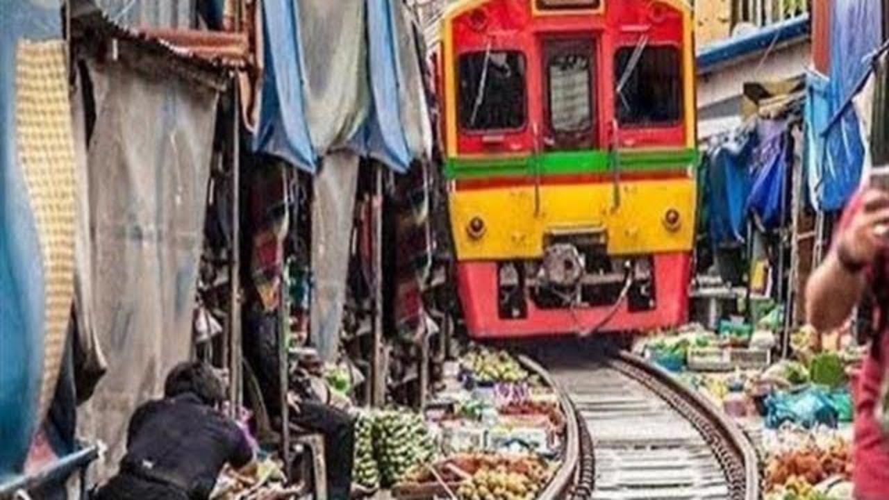 Thailand's Maeklong Railway Market | Where The Train Comes Right Through The Market!
