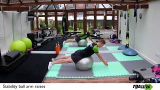 Exercise demonstration of stability ball arm raises