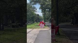 Woman on St. Charles Ave. paying tribute to Dolly Parton
