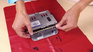 Lenovo ThinkSystem V3 2U server installing a four bay 2.5-inch rear drive backplane and drive cage