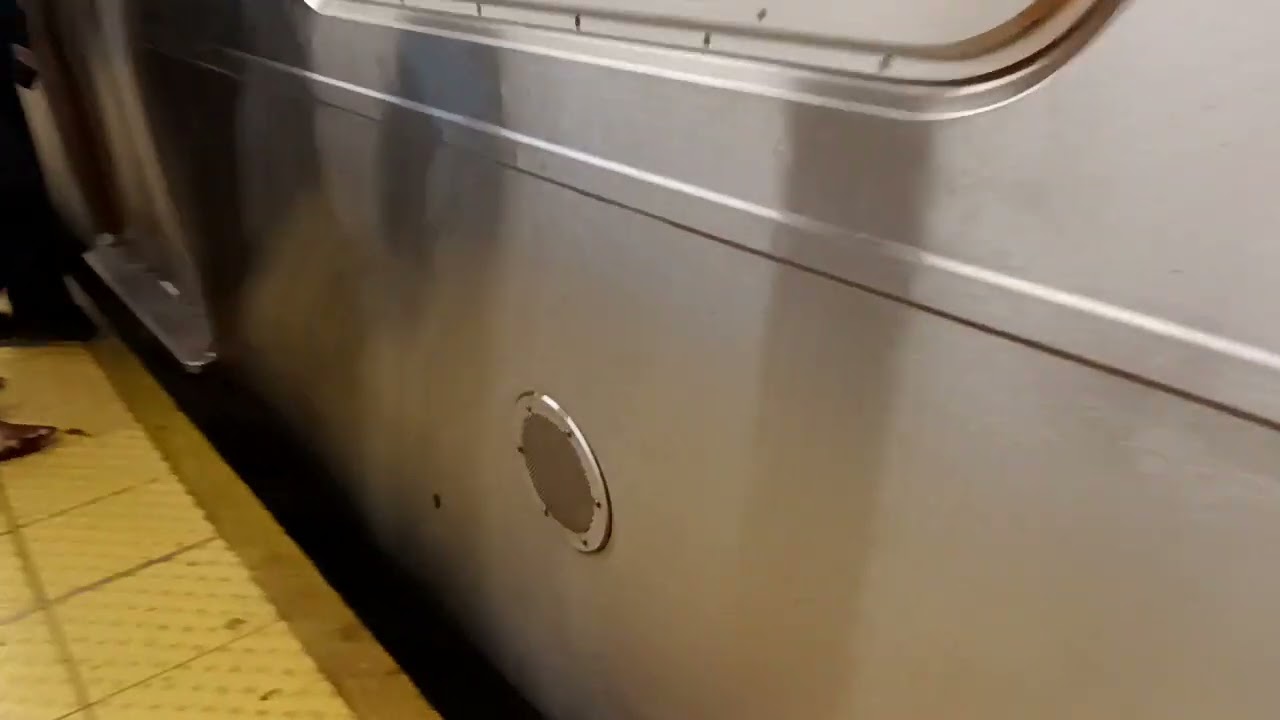 this is a Manhattan bound F express train via the E line the next stop is Queens plaza