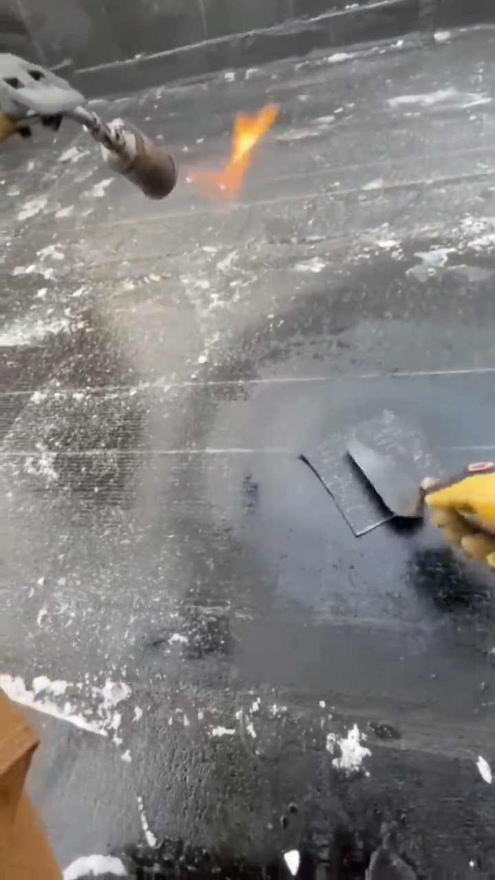Flat roof repair torchdown patch. #shorts #roof #roofer #roofing #roofershelper #fyp #repair by The Roofer's Helper