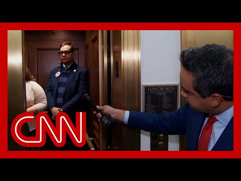 Watch Santos dodge questions from CNN reporter on live TV