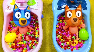 Baby Dolls Bluey and Bingo candy bath time- Meeting baby shark and opening surprise eggs