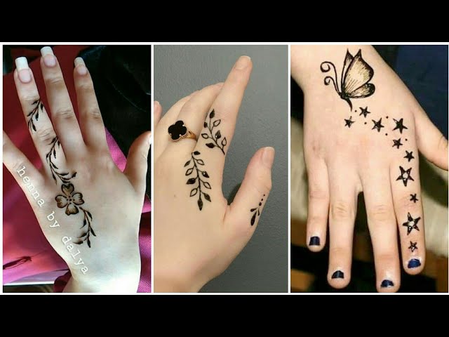 hand of small girl being decorated with henna mehendi Tattoo. Close-up,  overhead view - beauty concept Stock Photo | Adobe Stock