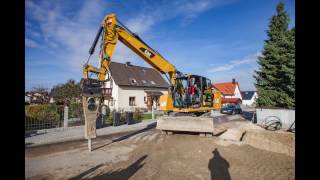 Cat M318F with engcon fully hydraulic Quick Coupler