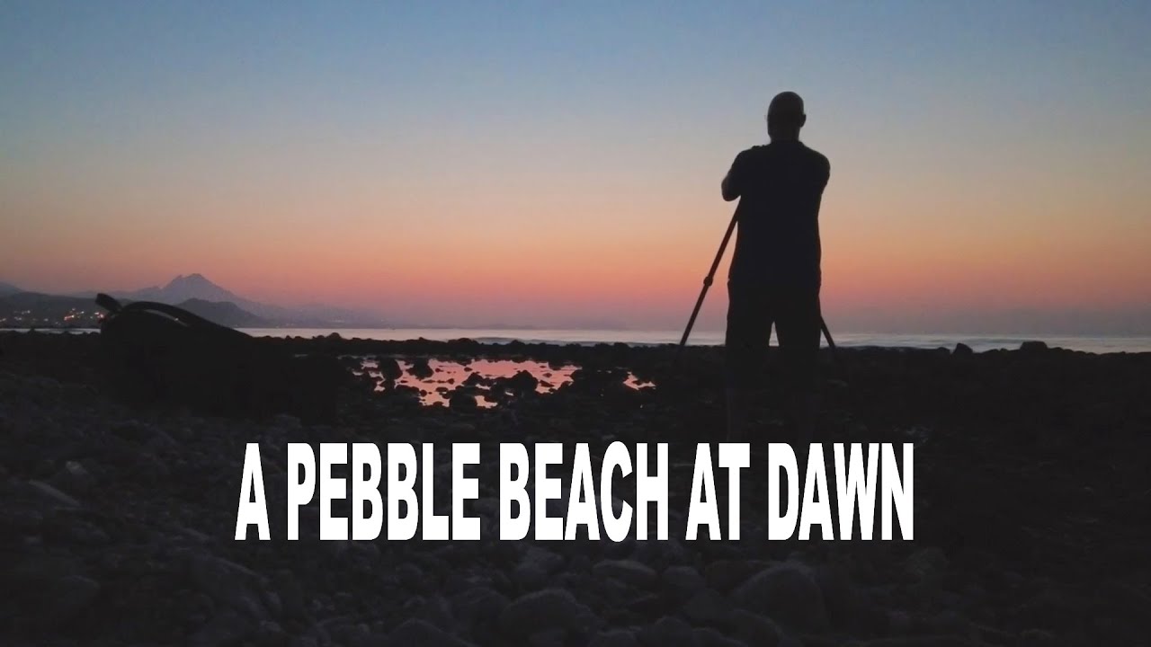 LANDSCAPE PHOTOGRAPHY ON A PEBBLE BEACH AT DAWN