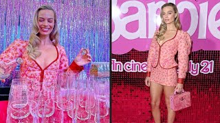 WOW ‼️Margot Robbie puts on a leggy display in a pink suit and HUGE platform heels 😍