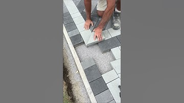 Installation of patterned paving blocks. #shorts