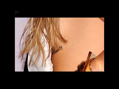 All the Miley Cyrus tattoos and piercings: UPDATE! January 2011 - including new cross tattoo!