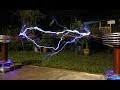 Twin tesla coils out of phase playing the same music channel