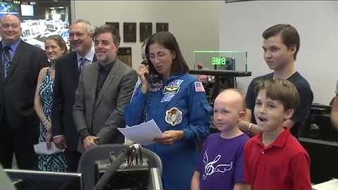 Space Station Crew Unveils "Space Suit" Designed by Cancer Patients on Earth