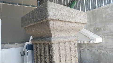 Cement hard coat on expanded polystyrene column shape.