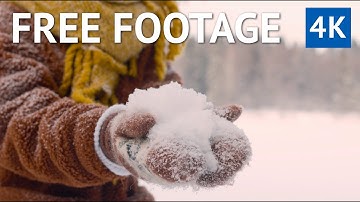 FREE 4K VIDEO - Young Woman Holding a Snowball In Her Hands